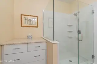 221 Woodlands Way Unit 21, Calabash, NC 28467 — 2-bedroom condo in Crow Creek, Calabash, NC, photo 17 of 39: Added Stroage and Vanity in Primary