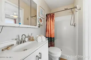 1426 N New River Drive, Surf City, NC 28445 – photo 19: Upstairs Guest Bathroom Virtually Staged
