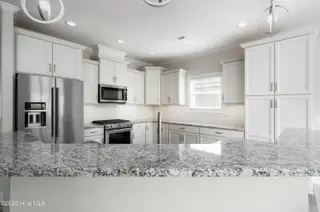 8983 Mango Bay Court NE, Leland, NC 28451 — 4-bedroom townhome in Compass Pointe, Leland, NC, photo 13 of 53: Stainless Steel Appliances/Gas Range