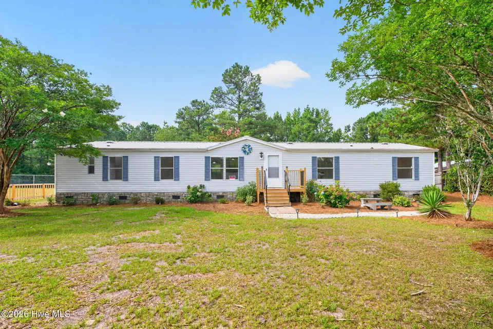 1199 Zack Street SE, Bolivia, NC 28422 — 4-bedroom manufactured home in Sandy Branch Retreat, Bolivia, NC, photo 1 of 44