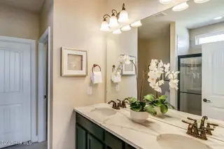 257 Eagle Claw Drive 4018, Carolina Shores, NC 28467 – photo 10: Bedrock - Owners Bath