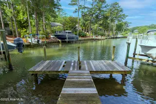 117 White Ash Drive, Pine Knoll Shores, NC 28512 – photo 1: Dock at end of canal