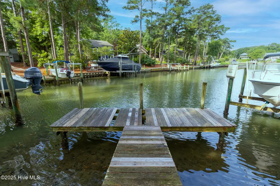 117 White Ash Drive, Pine Knoll Shores, NC 28512 – photo 1 of 40: Dock at end of canal