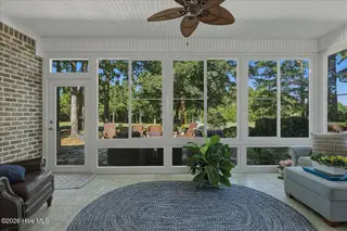 8309 Oak Abbey Trail NE, Leland, NC 28451 — 3-bedroom home in Compass Pointe, Leland, NC, photo 22 of 66: Glass Enclosed Sunroom