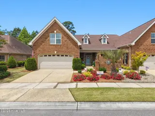 8266 Stenton Drive NE, Leland, NC 28451 — 3-bedroom townhome in Compass Pointe, Leland, NC, photo 3 of 58: 01-DJI_20260508123527_0195_D