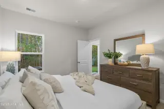 824 Palm Frond Way NW, Calabash, NC 28467 – photo 23: King bed in owner suite