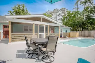 221 NE 58th Street, Oak Island, NC 28465 – photo 7: HUGE SCREENED IN PORCH
