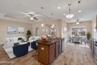 123 Bellwood Circle, Sunset Beach, NC 28468 – photo 12: Kitchen to LR staged