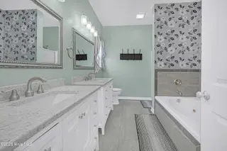 409 Womble Street, Oak Island, NC 28465 – photo 22: Primary En Suite Bathroom