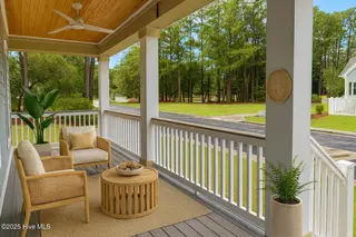 9148 E Lake Road, Calabash, NC 28467 – photo 3: 397 Front Porch 1 - VS