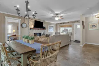 209 NE 56th Street, Oak Island, NC 28465 – photo 11: 23-Final 209 NE 56th St OKI-RJREM-9435