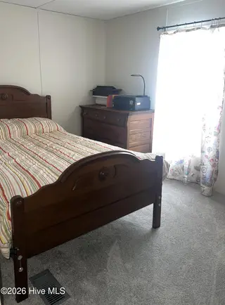 2773 Pirate Lane SW, Supply, NC 28462 — 3-bedroom manufactured home in Buccaneer Hills, Supply, NC, photo 19 of 47: 2773 Pirate Bedroom 2