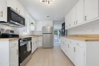 728 Warrior Trail, Whiteville, NC 28472 – photo 12: Kitchen w/ Door to Porch Open!