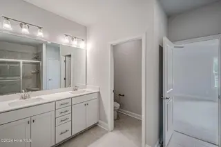 1025 Wood Creek Road NE, Leland, NC 28451 – photo 21: *REPRESENTATIVE PHOTO* Master Bathroom
