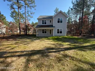 724 Blue Bird Drive, Vass, NC 28394 – photo 8: 724 rear