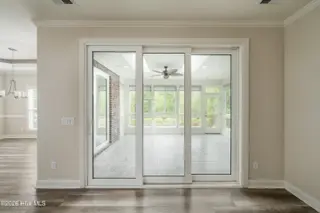 8983 Mango Bay Court NE, Leland, NC 28451 — 4-bedroom townhome in Compass Pointe, Leland, NC, photo 19 of 53: Telescopic Doors