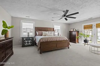 213 Pensacola Avenue, Morehead City, NC 28557 – photo 11: Master Bedroom With Private Backyard Acc