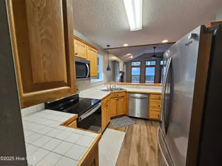 3235 Marsh View Drive SW, Supply, NC 28462 — 3-bedroom home in Lockwood Folly, Supply, NC, photo 5 of 36: Kitchen