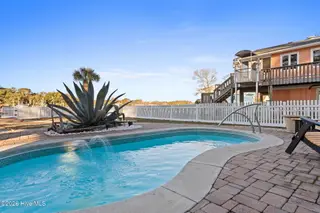 1404 W Yacht Drive, Oak Island, NC 28465 – photo 23: In-ground pool 2