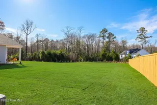 273 Ocean Pointe Boulevard SE 1801, Bolivia, NC 28422 – photo 11: AI Generated- Backyard-mls