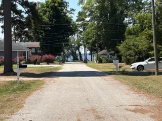 303 Dallas Avenue, Lake Waccamaw, NC 28450 — 3-bedroom home, Lake Waccamaw, NC, photo 4 of 40: Street View