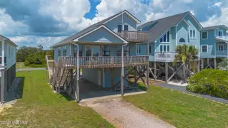 2523 W Dolphin Drive, Oak Island, NC 28465 – photo 1: 1_2523 w dolphin dr-00040
