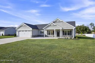 103 Fynloch Chase Drive, Fremont, NC 27830 – photo 2: Suburban home under a sunny sky