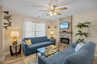 111 NW 10th Street, Oak Island, NC 28465 – photo 9: 21 living room