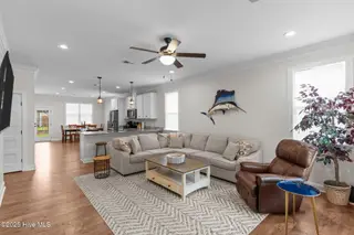 162 NW 9th Street, Oak Island, NC 28465 – photo 6: open living dining kitchen