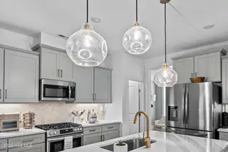 4025 Watersail Drive, Wilmington, NC 28409 – photo 12: Arhaus Pendant Lights