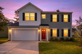 1439 Judith Drive SE, Bolivia, NC 28422 – photo 2: Twilight glow on suburban home