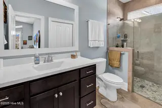 3032 Eno Lane, Leland, NC 28451 — 4-bedroom home in Brunswick Forest, Leland, NC, photo 22 of 55: Guest Bath