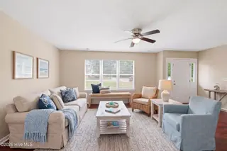 219 N Lake Keziah Drive, Southport, NC 28461 — 3-bedroom home in Boiling Spring Lakes, Southport, NC, photo 6 of 30: Photo 4 living room AI