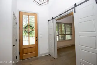 102 Greystones Court, Pinehurst, NC 28374 – photo 5: Foyer and barn door to office