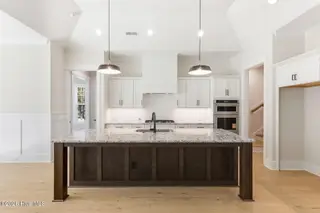 1943 Redfish SW, Supply, NC 28462 — 4-bedroom home in Oyster Harbour, Supply, NC, photo 14 of 42: Kitchen Island