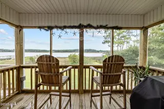 413 Pelican Harbor Road, Beaufort, NC 28516 — 3-bedroom home in Wards Creek Plantation, Beaufort, NC, photo 10 of 30: Screened porch off Primary Suite