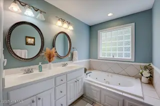 1704 Caracara Drive, New Bern, NC 28560 – photo 17: Bathroom double vanity and tub!