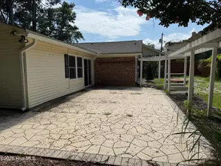 1043 High Point Avenue SW, Calabash, NC 28467 — 3-bedroom home in Calabash Acres, Calabash, NC, photo 7 of 7: Back patio