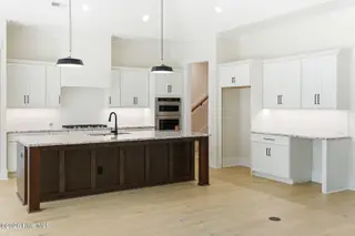 1943 Redfish SW, Supply, NC 28462 — 4-bedroom home in Oyster Harbour, Supply, NC, photo 16 of 42: Kitchen Island