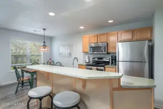 3350 Club Villas Drive 104, Southport, NC 28461 — 2-bedroom condo in St James, Southport, NC, photo 8 of 34: Island Bar for Friends
