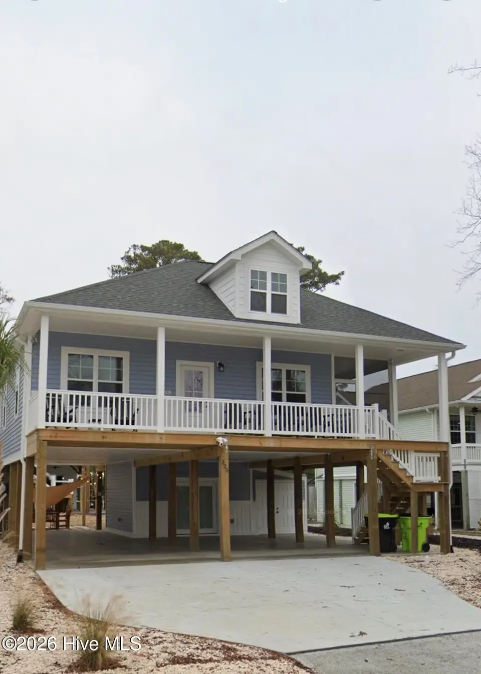 325 NE 56th Street, Oak Island, NC 28465 – photo 1 of 1: Front of Home