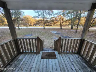 119 Edgewater Lane, Richlands, NC 28574 — 2-bedroom manufactured home in Chapel Ridge, Richlands, NC, photo 15 of 34: Covered Front Deck
