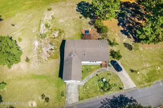 146 Ryder Cup Boulevard, Pinebluff, NC 28373 — 3-bedroom manufactured home in Oakwood Hill, Pinebluff, NC, photo 2 of 43: DJI_20260927144806_0490_D