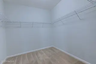 520 Slippery Rock Way, Calabash, NC 28467 — 3-bedroom home in The Farm, Calabash, NC, photo 17 of 33: Primary Walk-in Closet