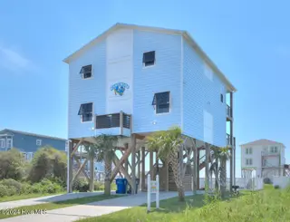 5207 E Pelican Drive, Oak Island, NC 28465 – photo 1: 5207 E Pelican Drive