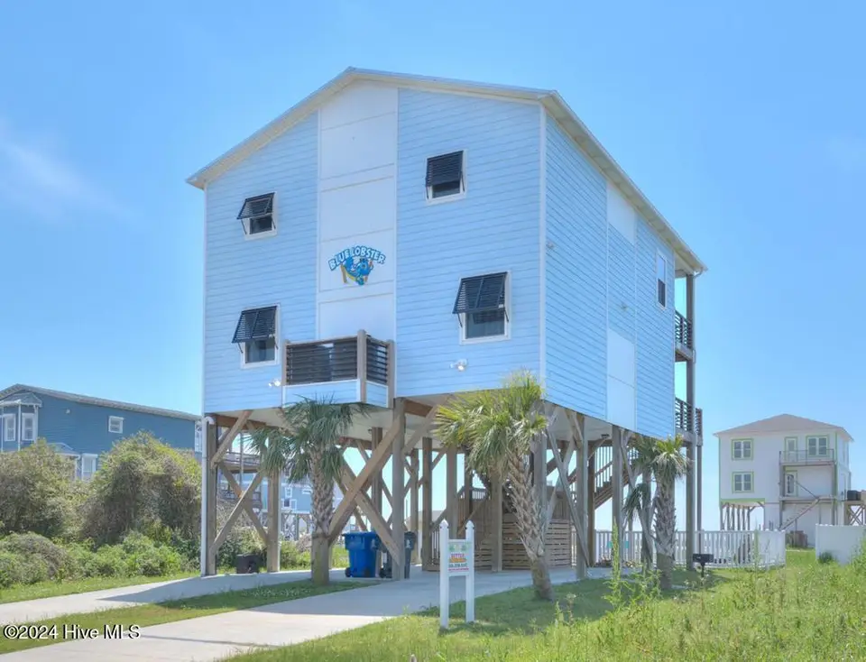 5207 E Pelican Drive, Oak Island, NC 28465 – photo 1 of 48: 5207 E Pelican Drive