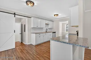 3504 Taylor Street, New Bern, NC 28560 — 4-bedroom home in Pinecrest, New Bern, NC, photo 10 of 28: Kitchen into Laundry