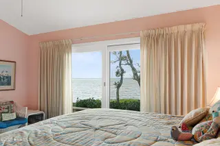 590 Westport Drive H1 Westport, Pine Knoll Shores, NC 28512 – photo 22: Primary suite with sound views