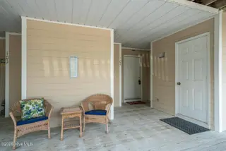 3350 Club Villas Drive 104, Southport, NC 28461 — 2-bedroom condo in St James, Southport, NC, photo 5 of 34: Entrance to Unit 104