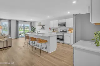 7111 Woodline Drive SW, Sunset Beach, NC 28468 – photo 17: Seaside Palms_Model_Venture_6911 Seaside